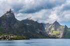 Norway, Hamnoy. Fishing village houses and mountains. Art Print